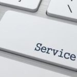 Close-up of a keyboard key marked "Service," showcasing its texture and modern design for plumbing support.
